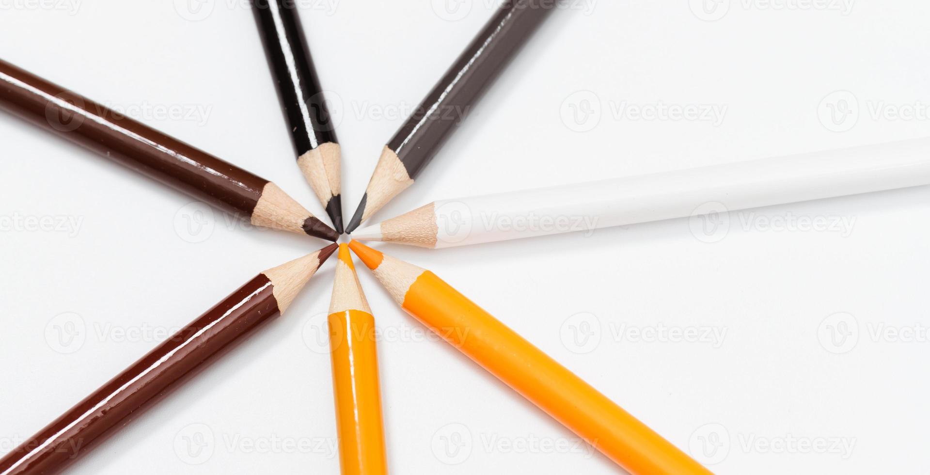 Multi color pencils. the concept of a multinational family and equality in the world. photo