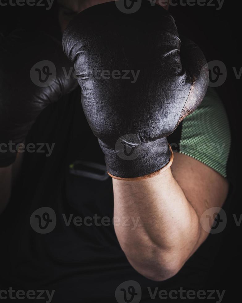 athlete is standing in a boxing rack photo