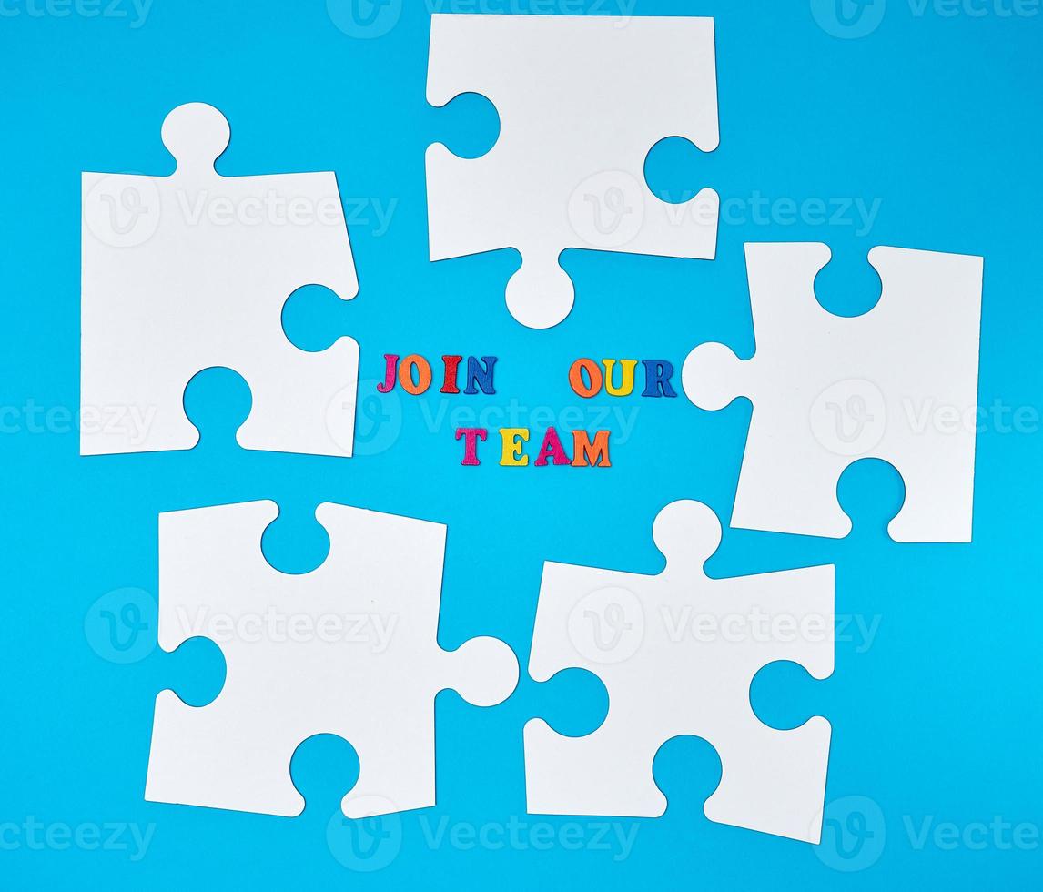 paper blank white puzzle on a blue background, the inscription join our team photo