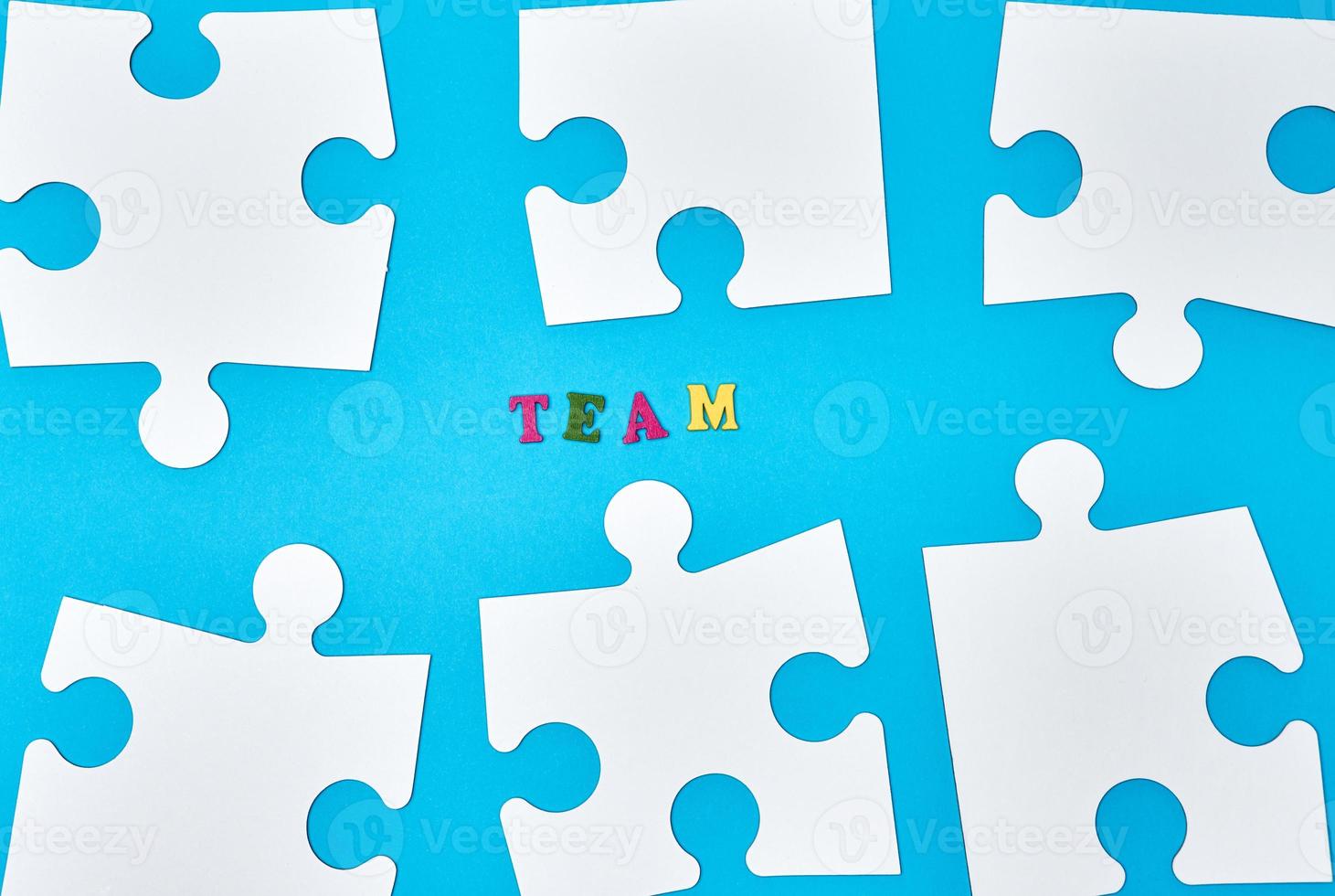 white big puzzles on a blue background photo