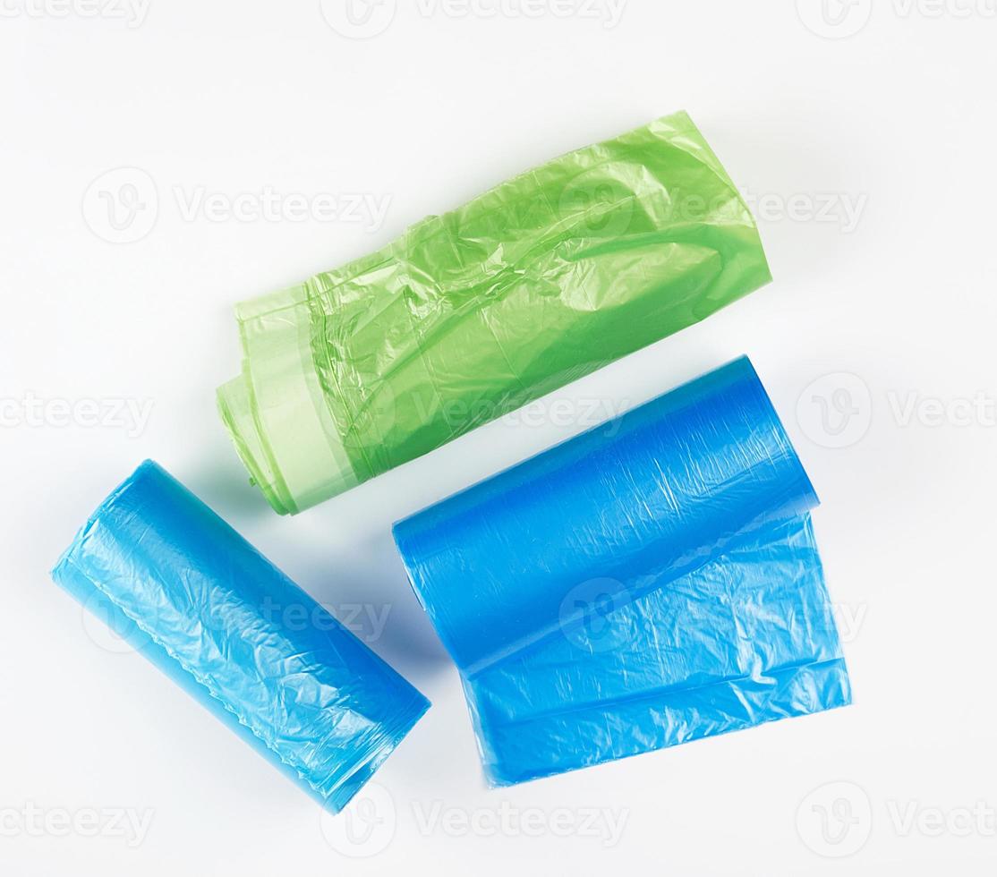three rolled up rolls with plastic garbage bags photo