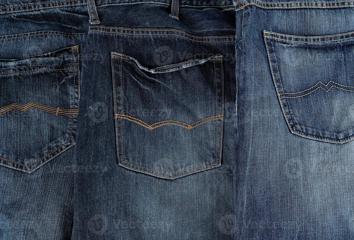 several other classic jeans folded in a row photo