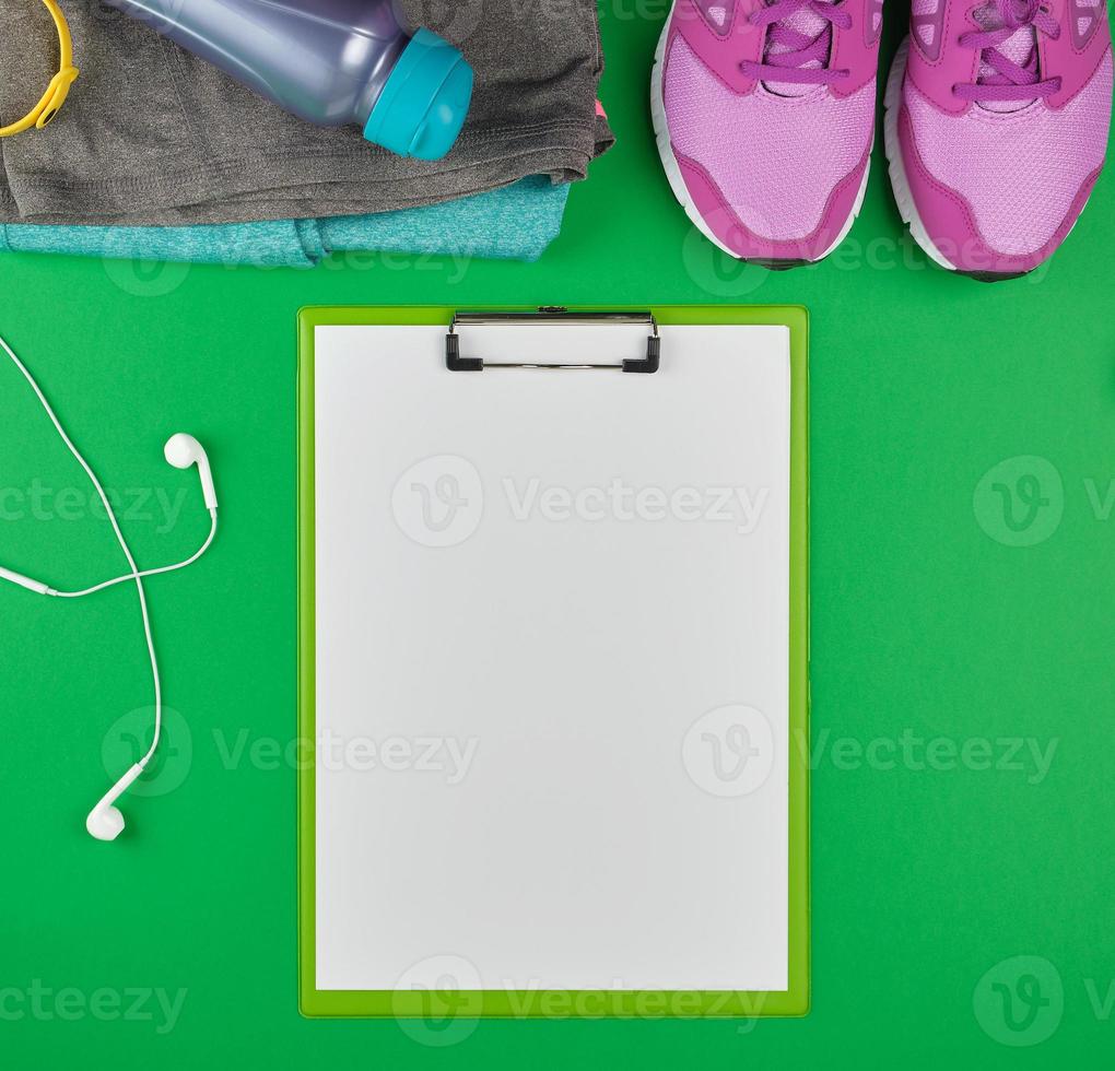 sports women's clothing for sports and fitness,  green background photo