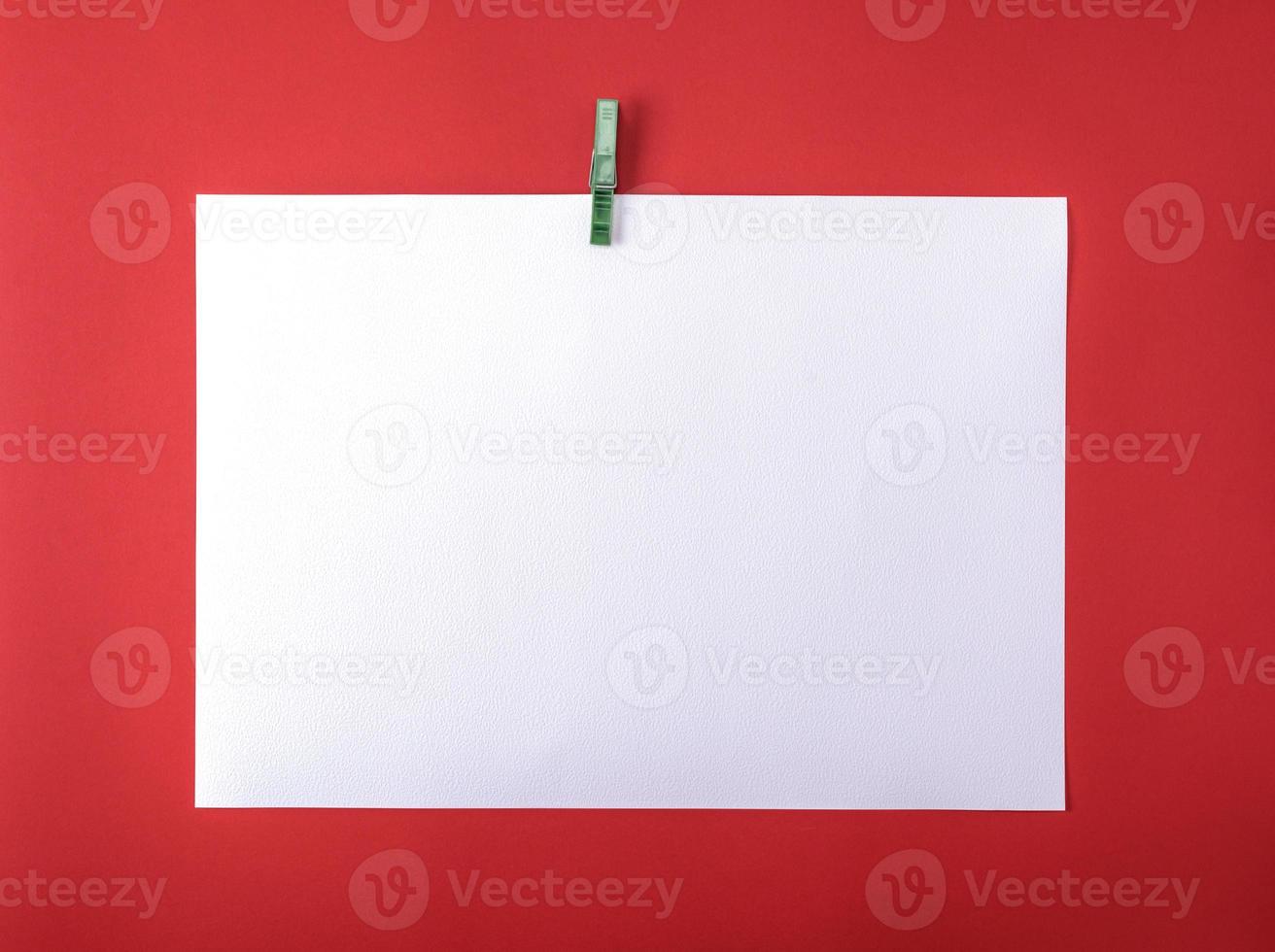 white blank drawing sheet on green plastic clothespin photo