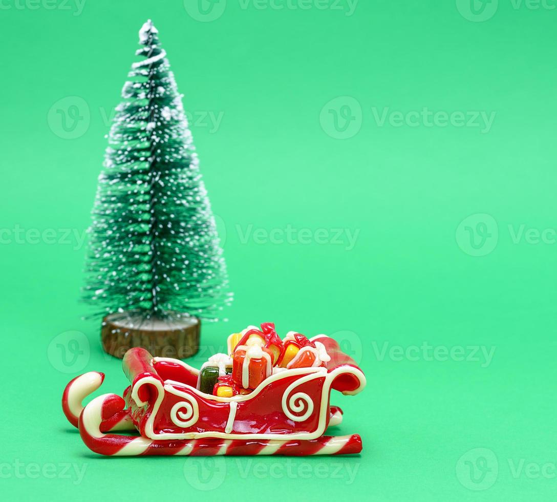 caramel sleigh on a green background photo