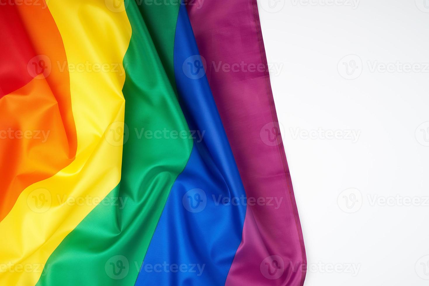 textile rainbow flag with waves,  symbol of freedom of choice of lesbians photo