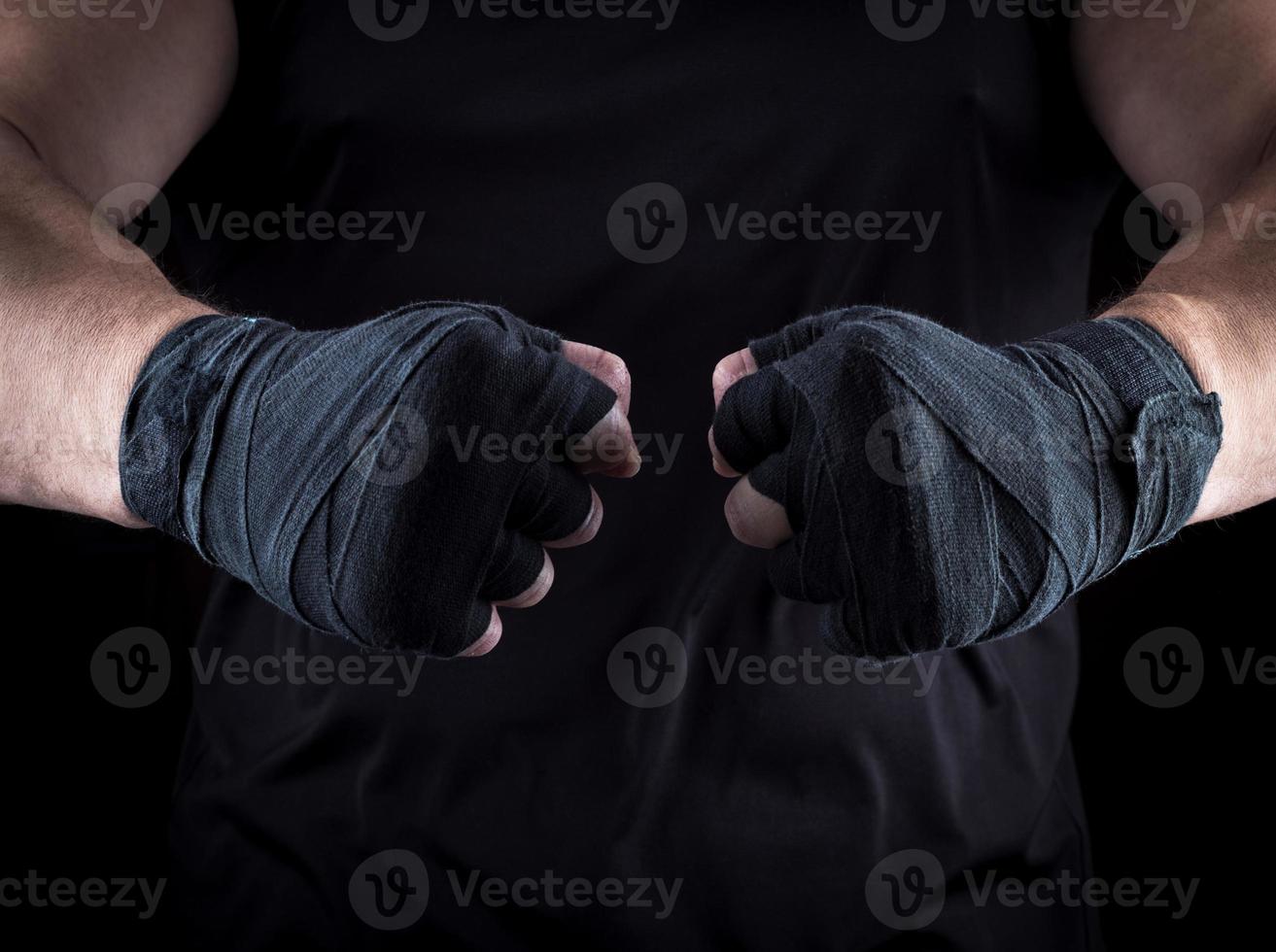 two men's hands wrapped in a black bandage photo