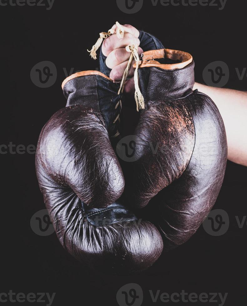 pair of leather sports boxing gloves in hand photo