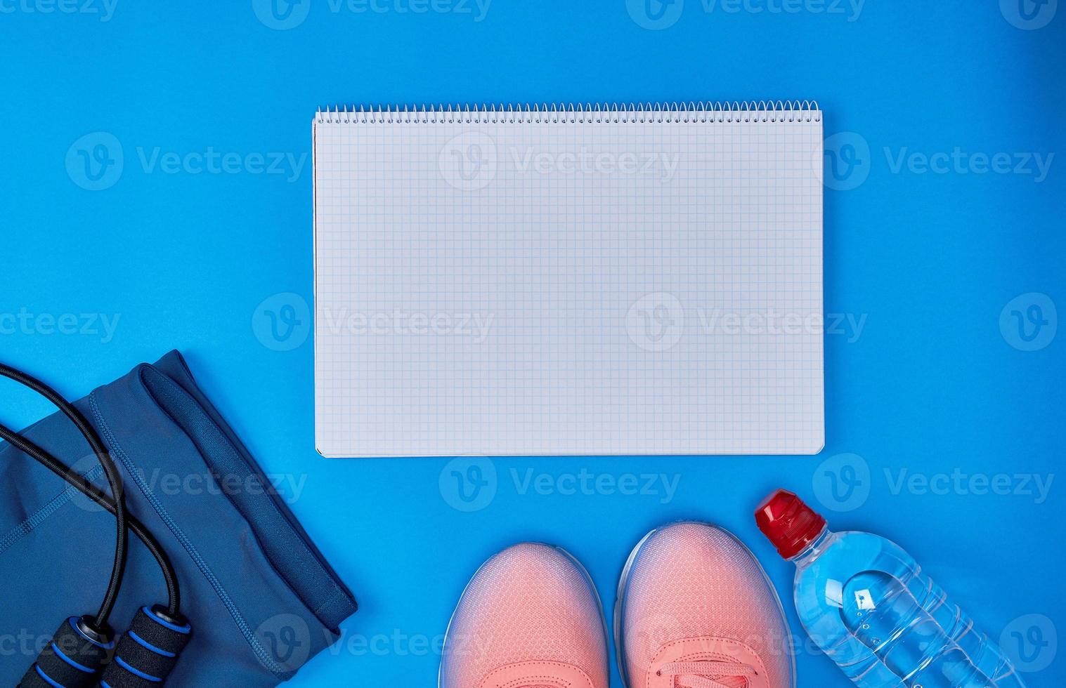 open empty notebook and  women's clothing for sports and fitness photo