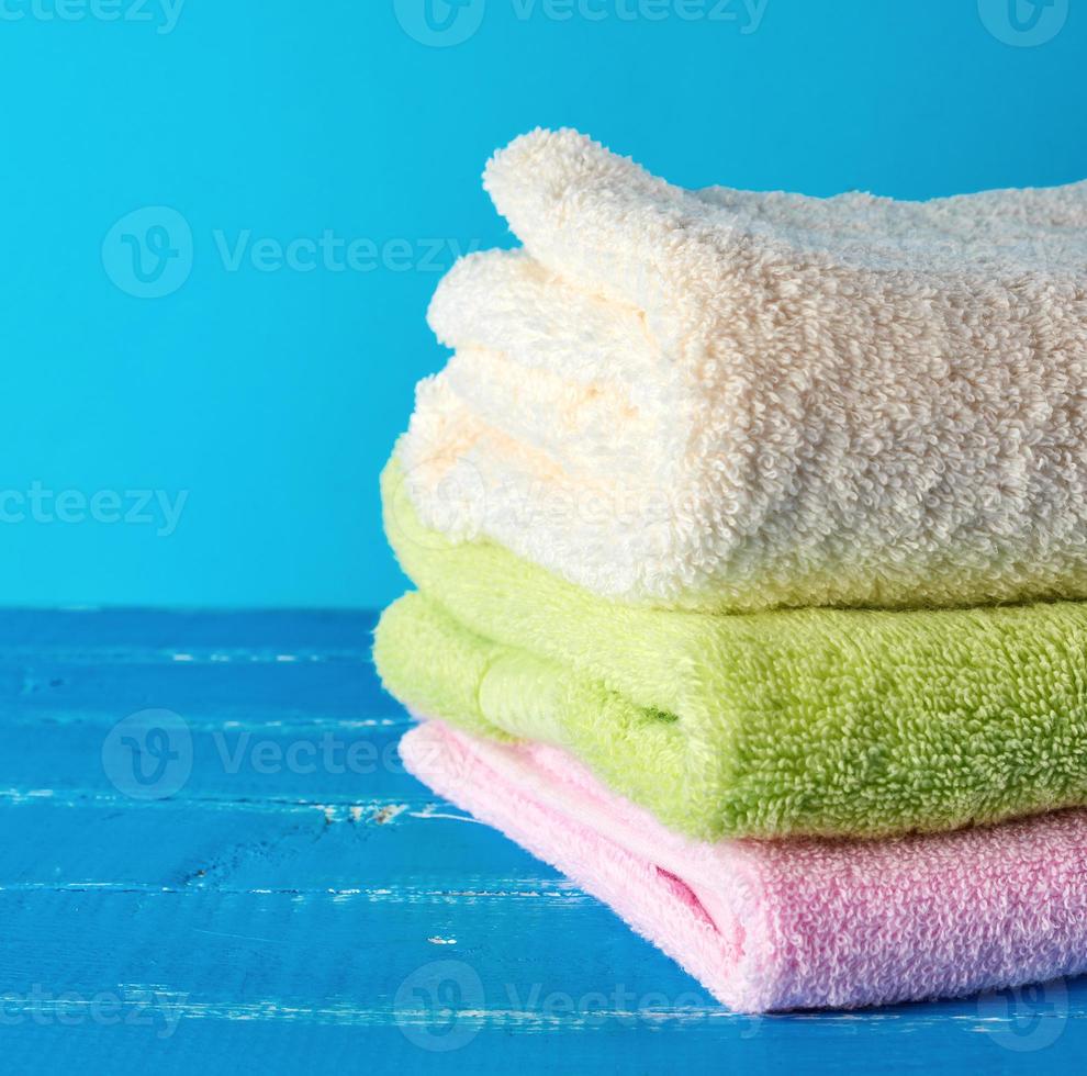 stack of multi-colored new terry bath towels photo