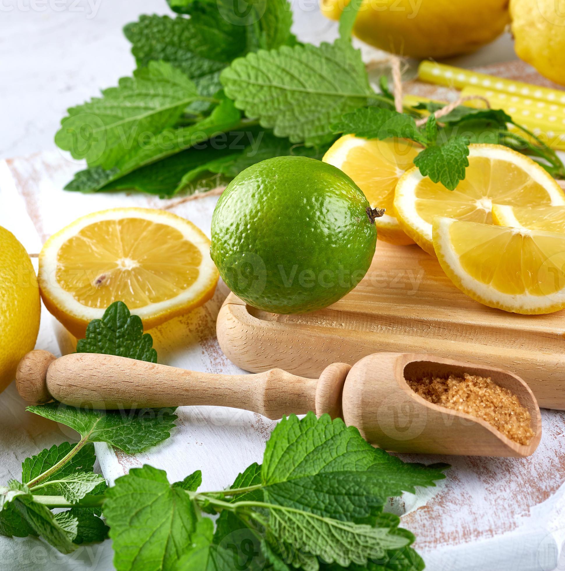 ripe yellow lemons and lime, brown sugar and a bunch of fresh mint 19166986 Stock Photo at Vecteezy