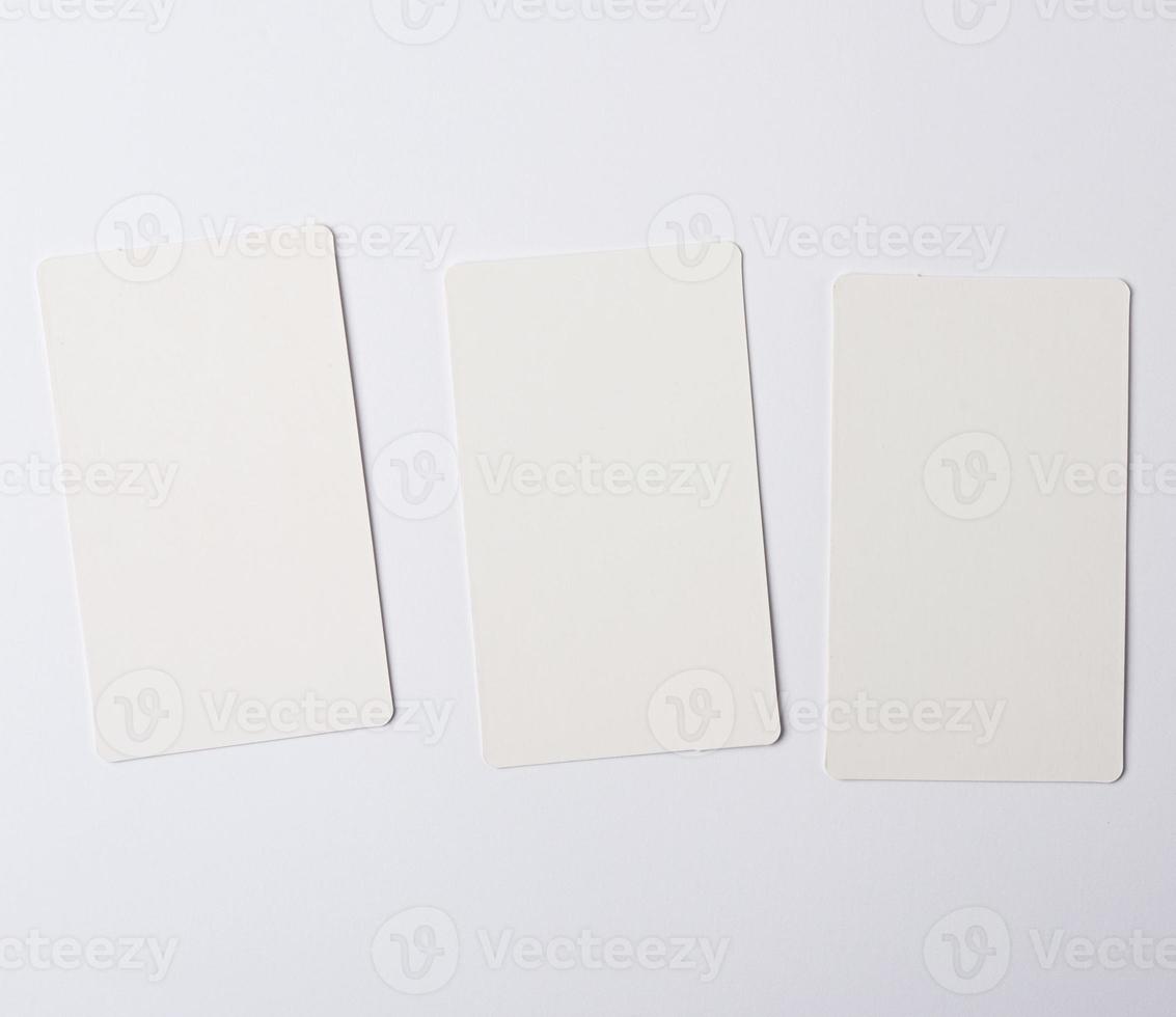 three empty rectangular paper white business business cards photo