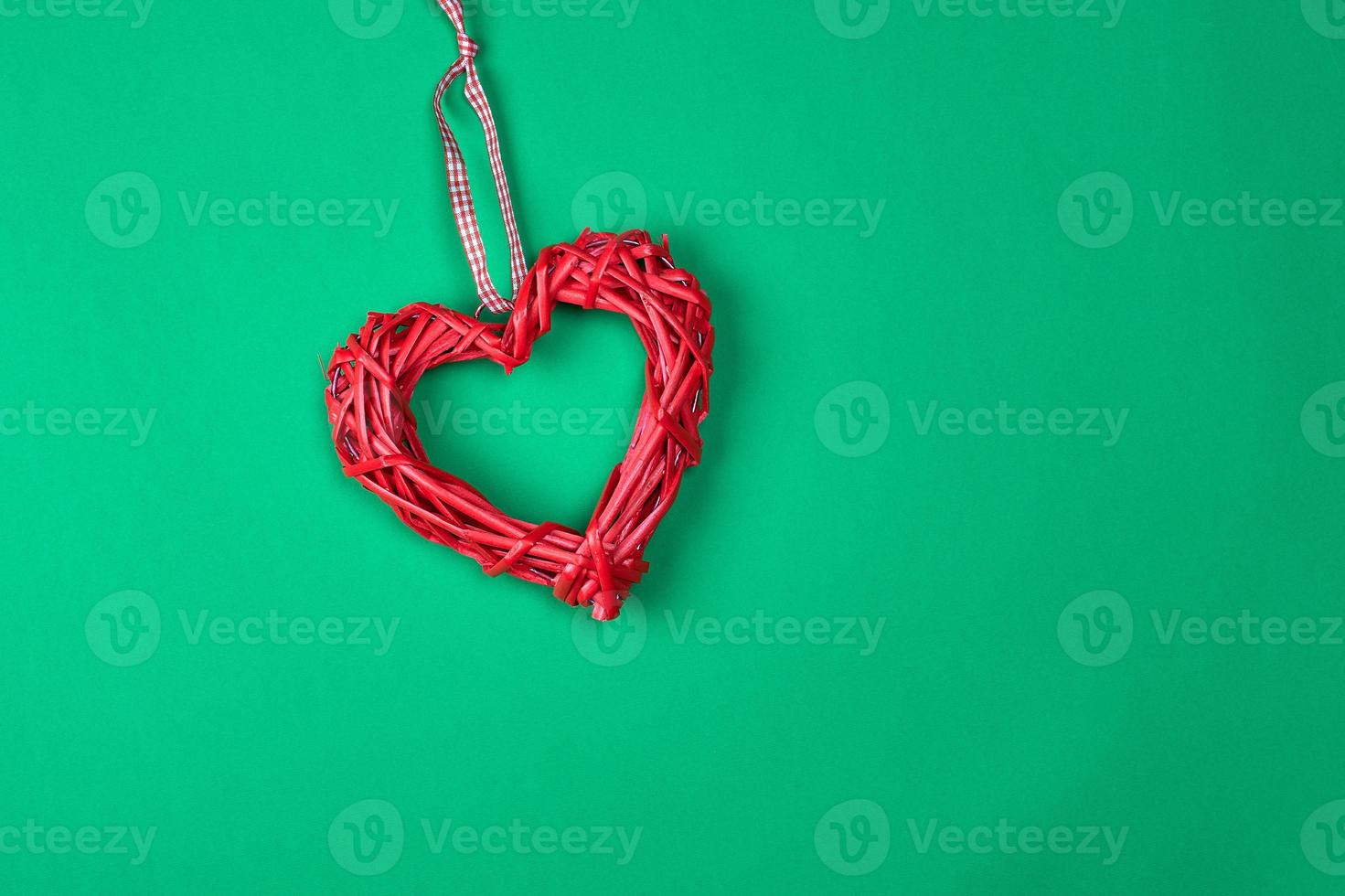 red decorative heart braided from a rod photo
