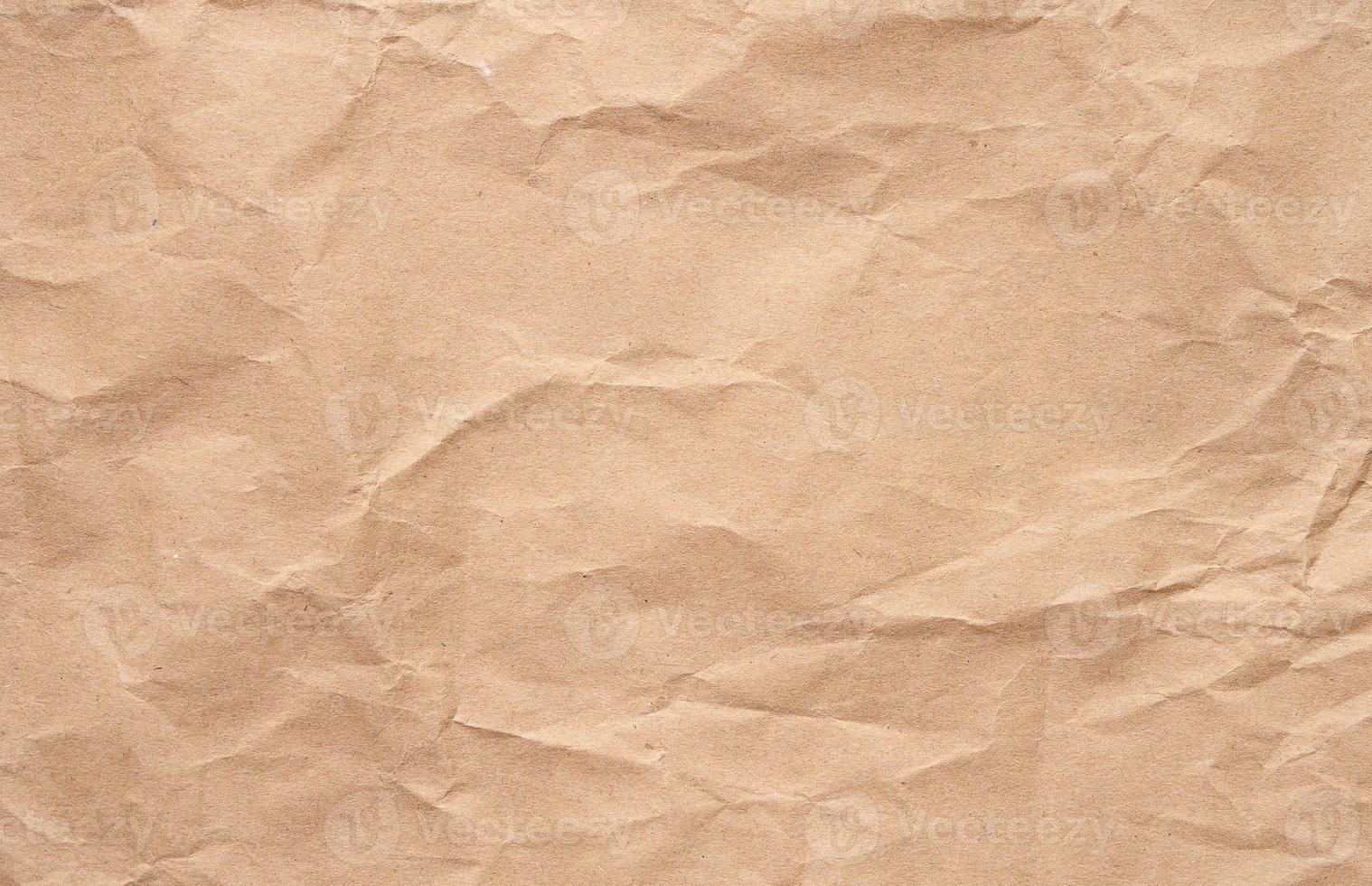 Texture of brown crumpled craft paper, full frame photo