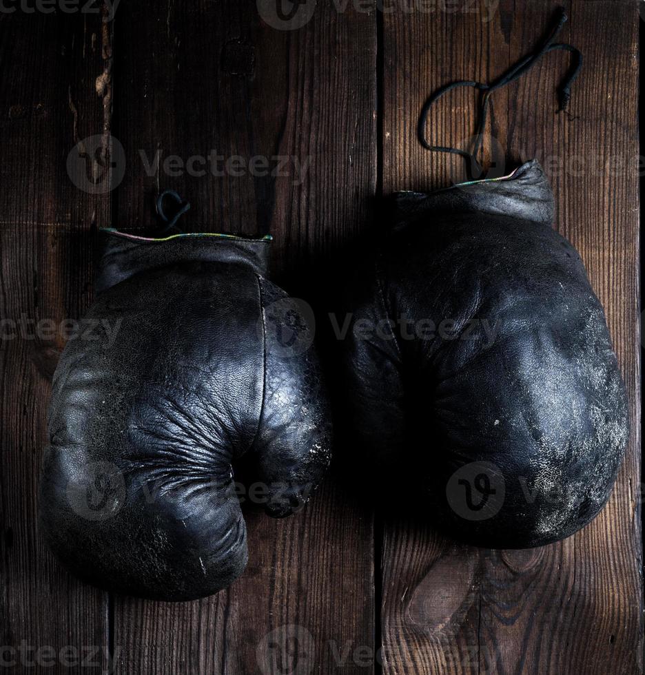 very old black boxing gloves photo