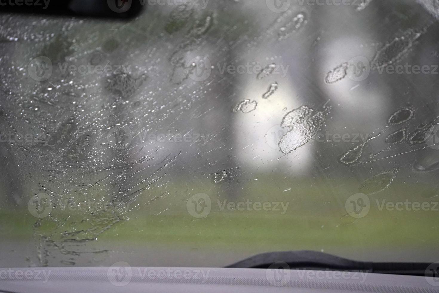 heavy rain on car windscreen wiper photo
