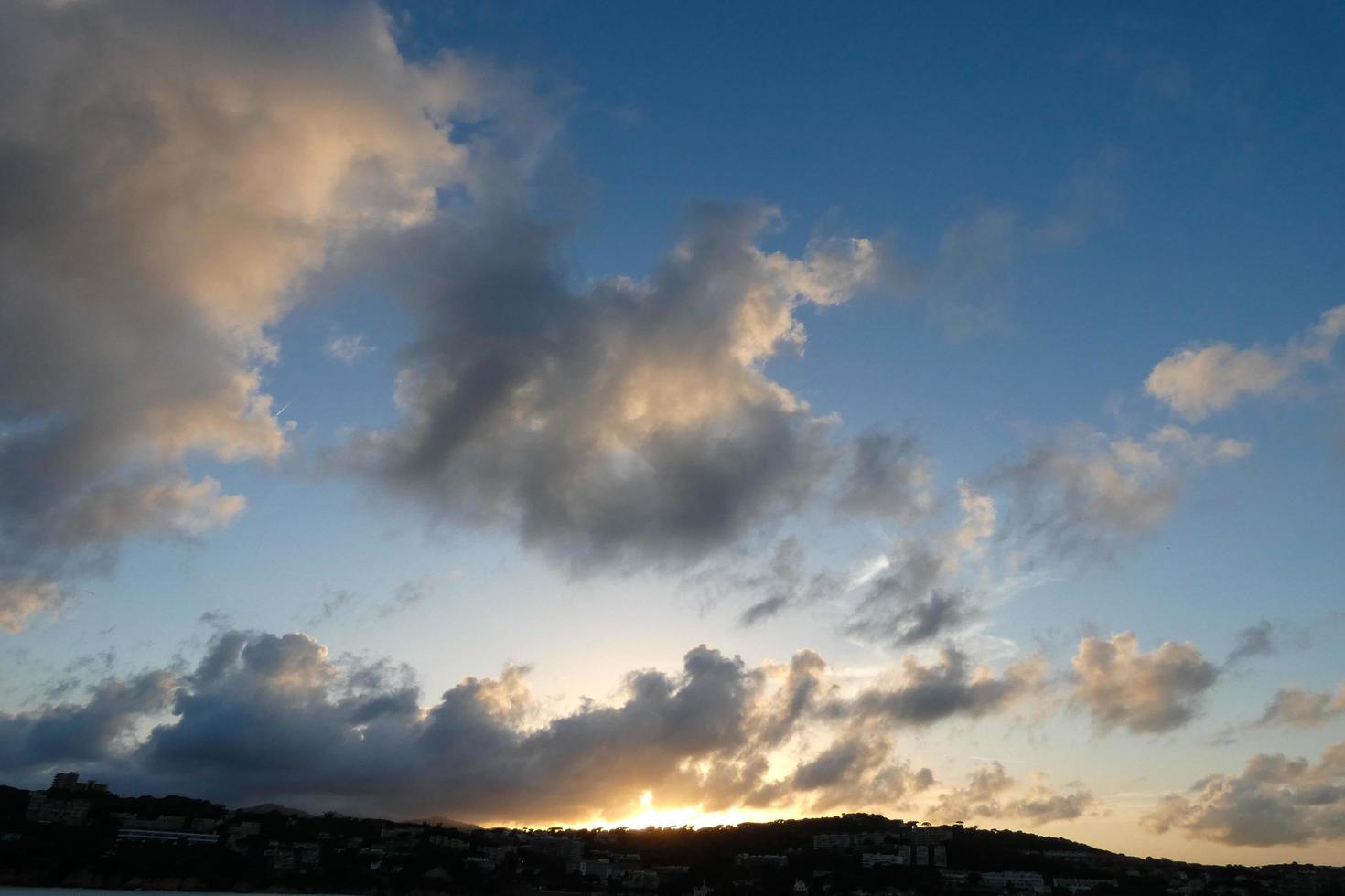 Clouds and light effects in the sky at dawn or dusk. photo