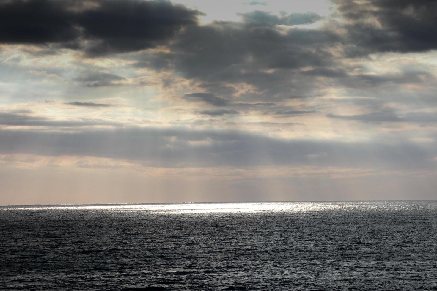 Clouds and light effects in the sky at dawn or dusk. photo