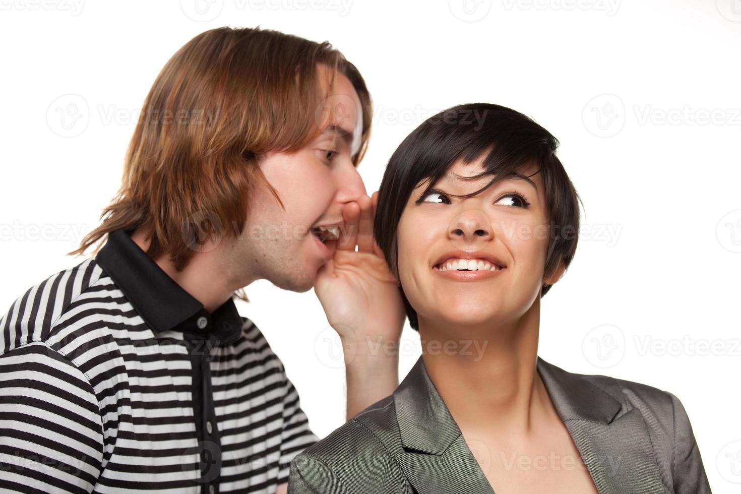 Attractive Diverse Couple Whispering Secrets photo