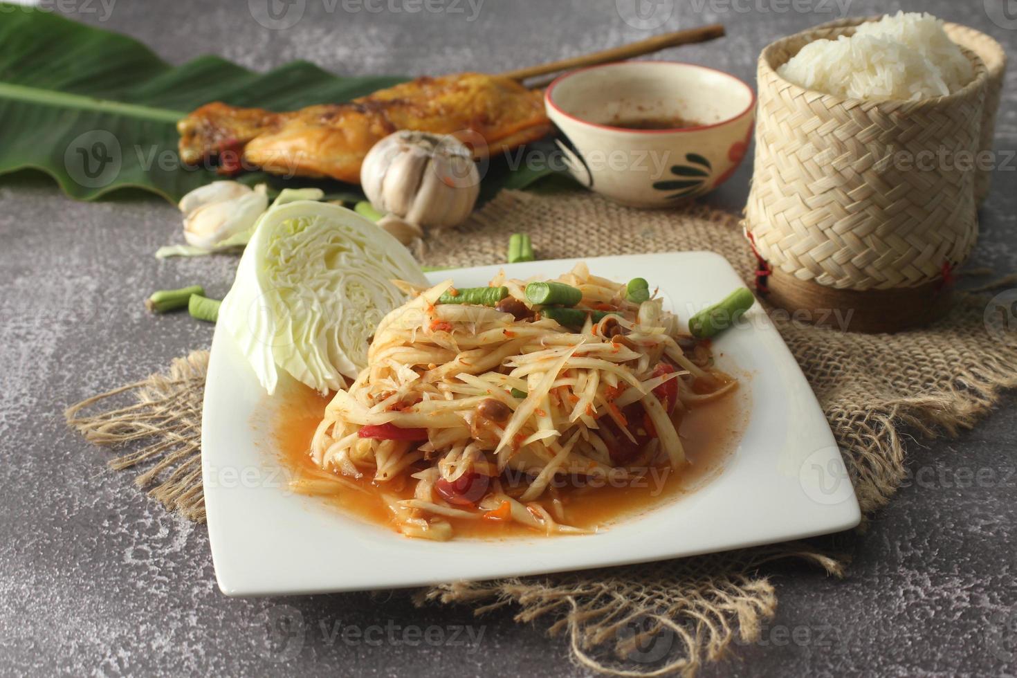 Popular Thai food and popular street food Papaya salad or what we called Somtum in Thailand photo