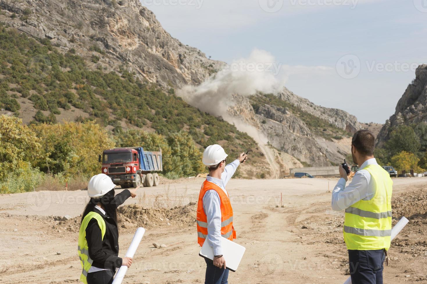 Engineers on construction site. Industrial blasting at a construction site photo