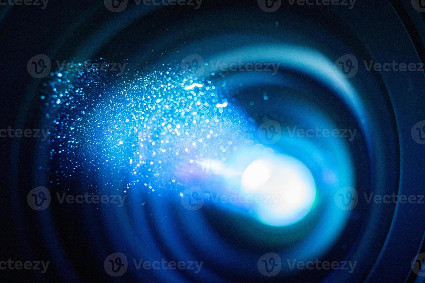 Tech review Lens macro close-up with dust particles in the air photo