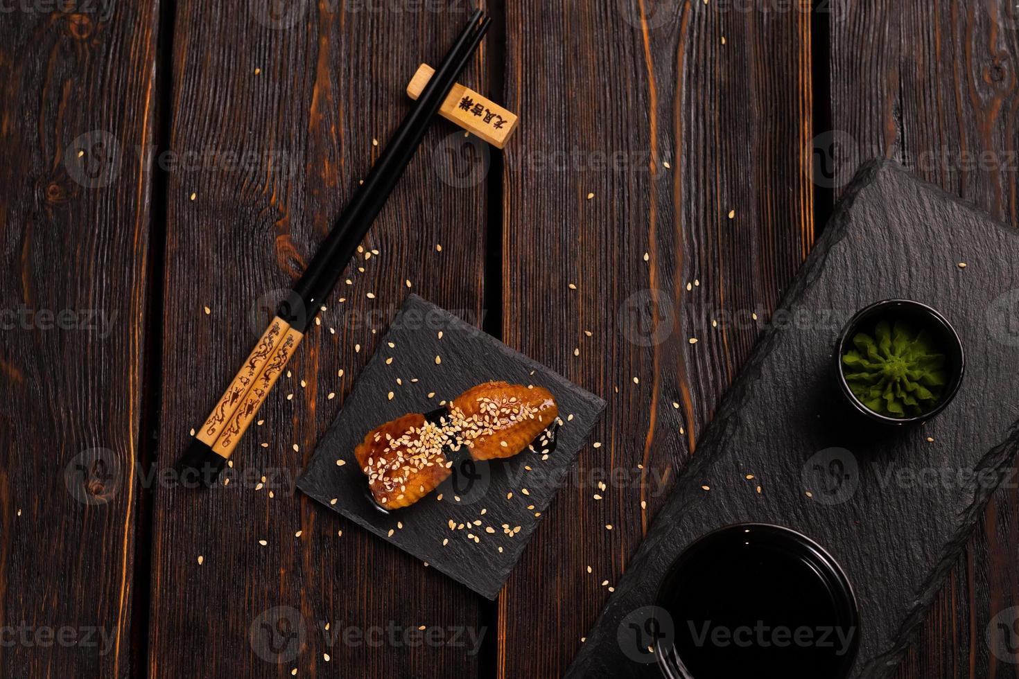 Japanese sushi smoked eel on wooden background top view photo