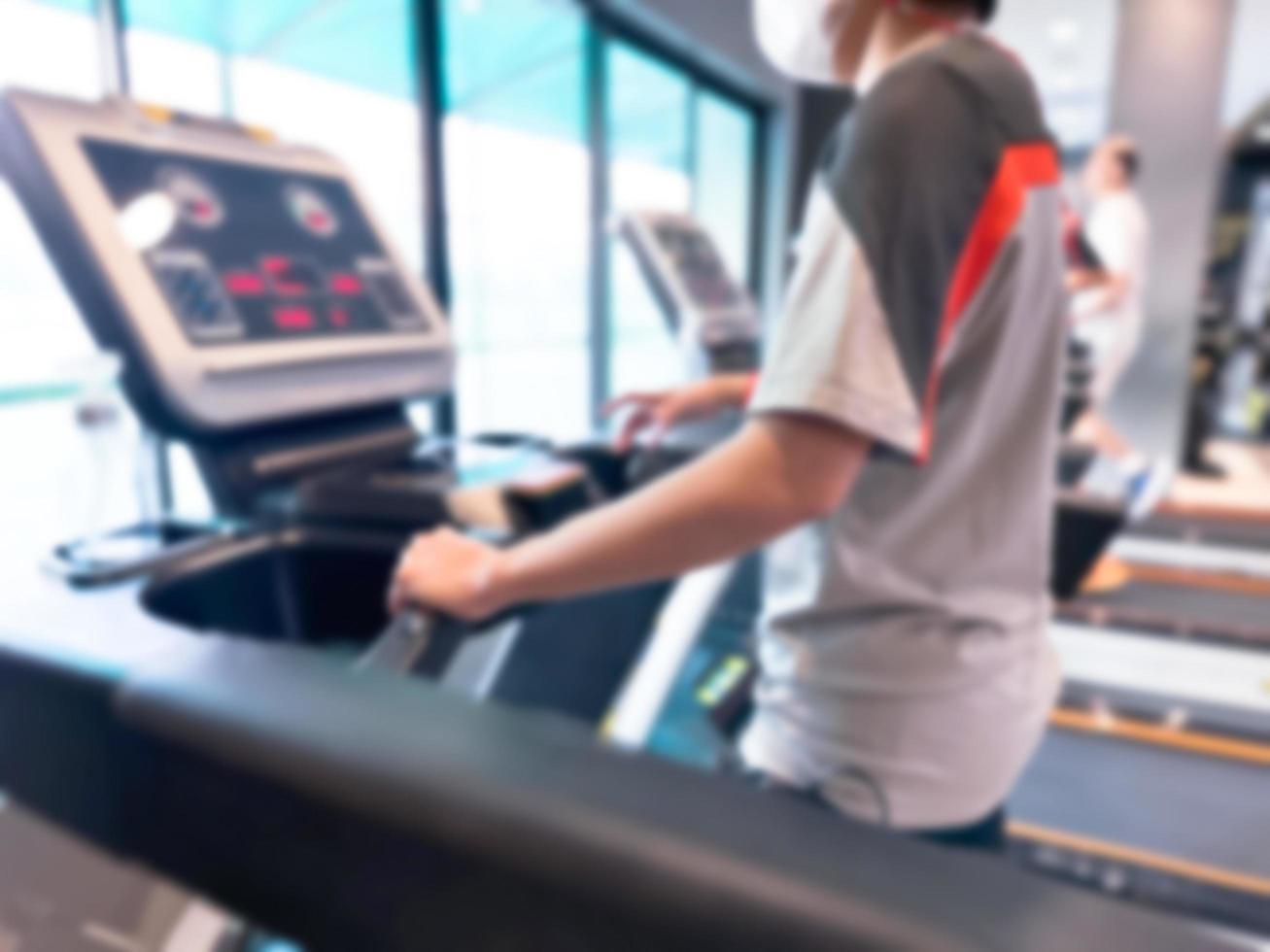 Blur image about exercising on walking treadmill at gym or fitness. Concept for healthy and lose weight. photo