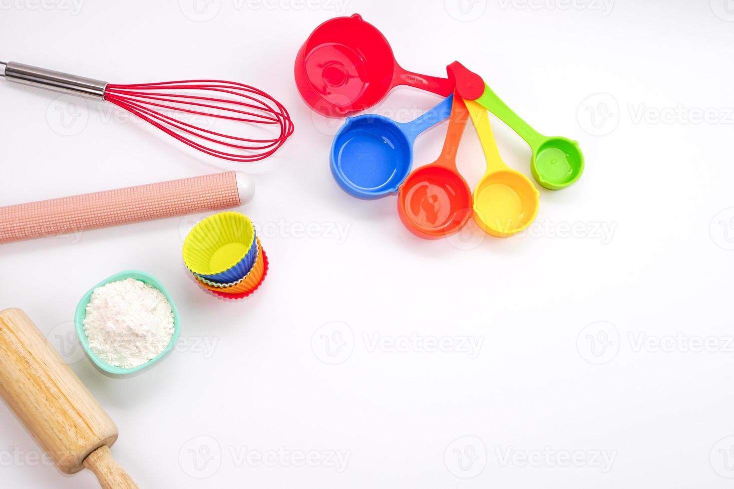 Top view set of kitchen utensils and ingredients for bakery on white background. Materials or kitchen equipment for bakery. photo