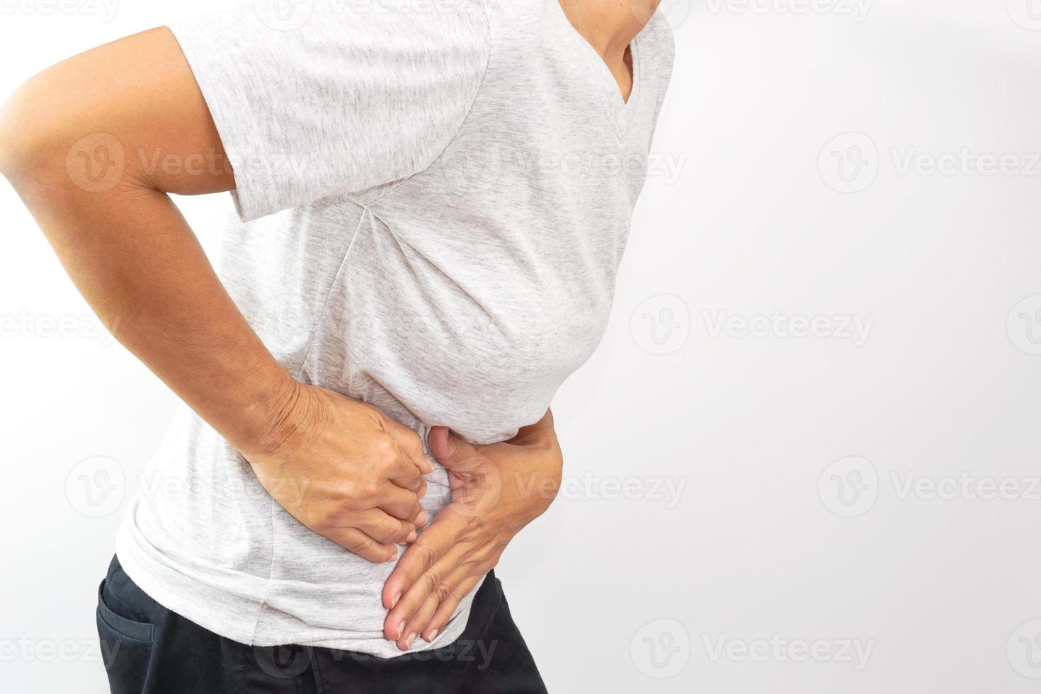 Asian woman suffering from stomachache. Chronic gastritis, menstruation and health concept. photo