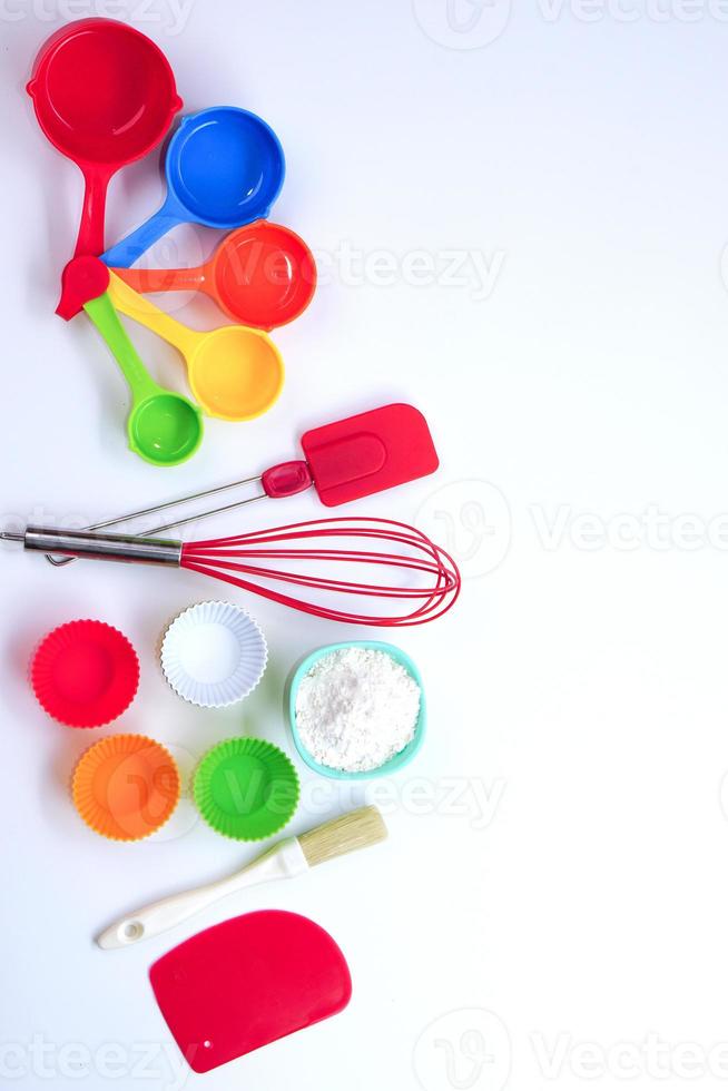 Top view set of kitchen utensils and ingredients for bakery on white background. Materials or kitchen equipment for bakery. photo