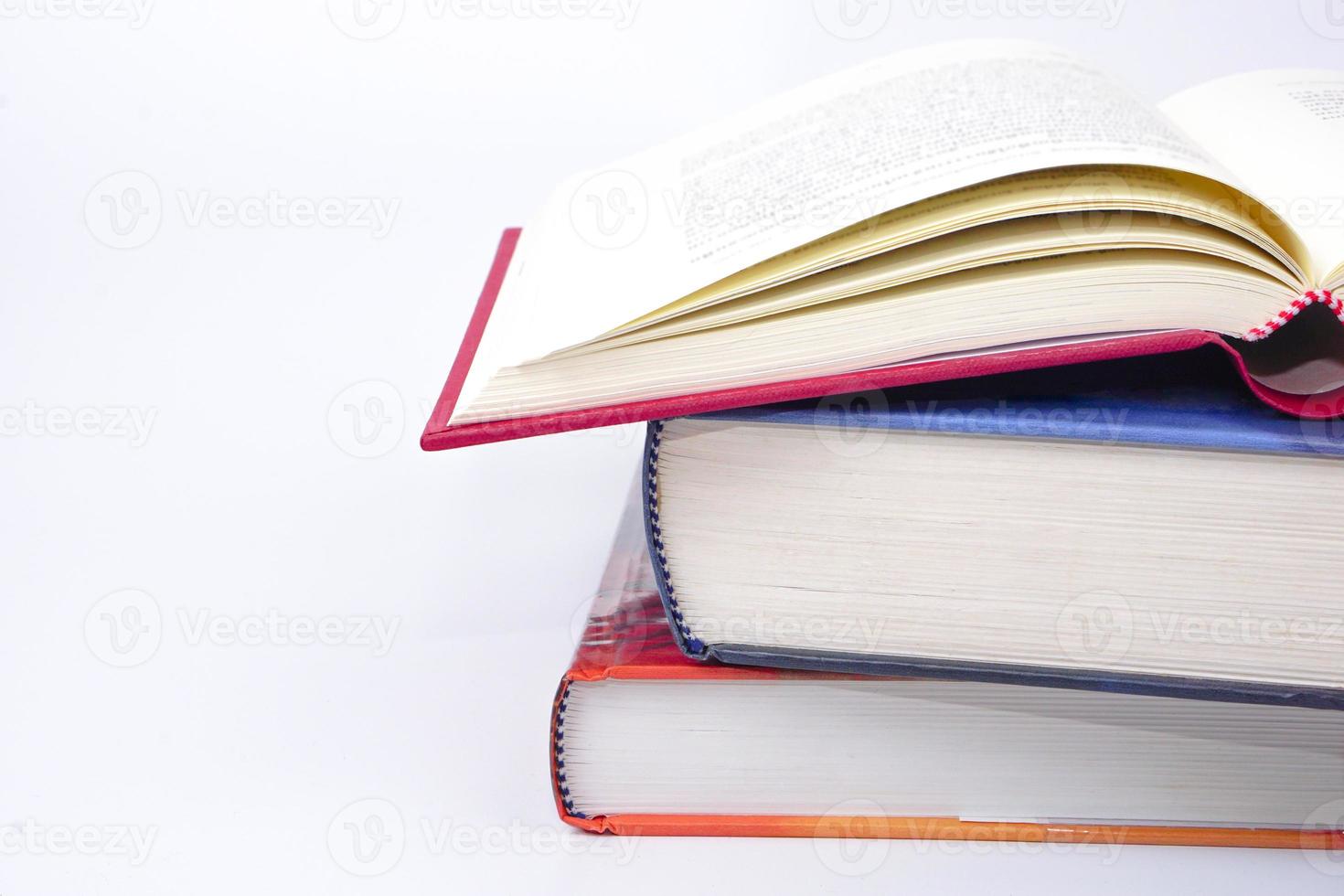 Stack of books on white background. Knowledge and education concept. photo