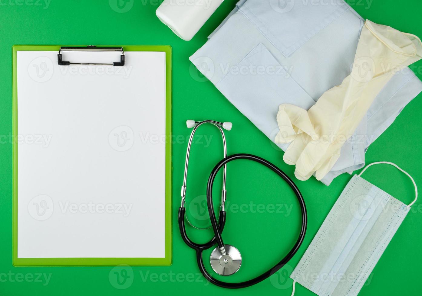 paper holder with empty white sheets, medical stethoscope photo