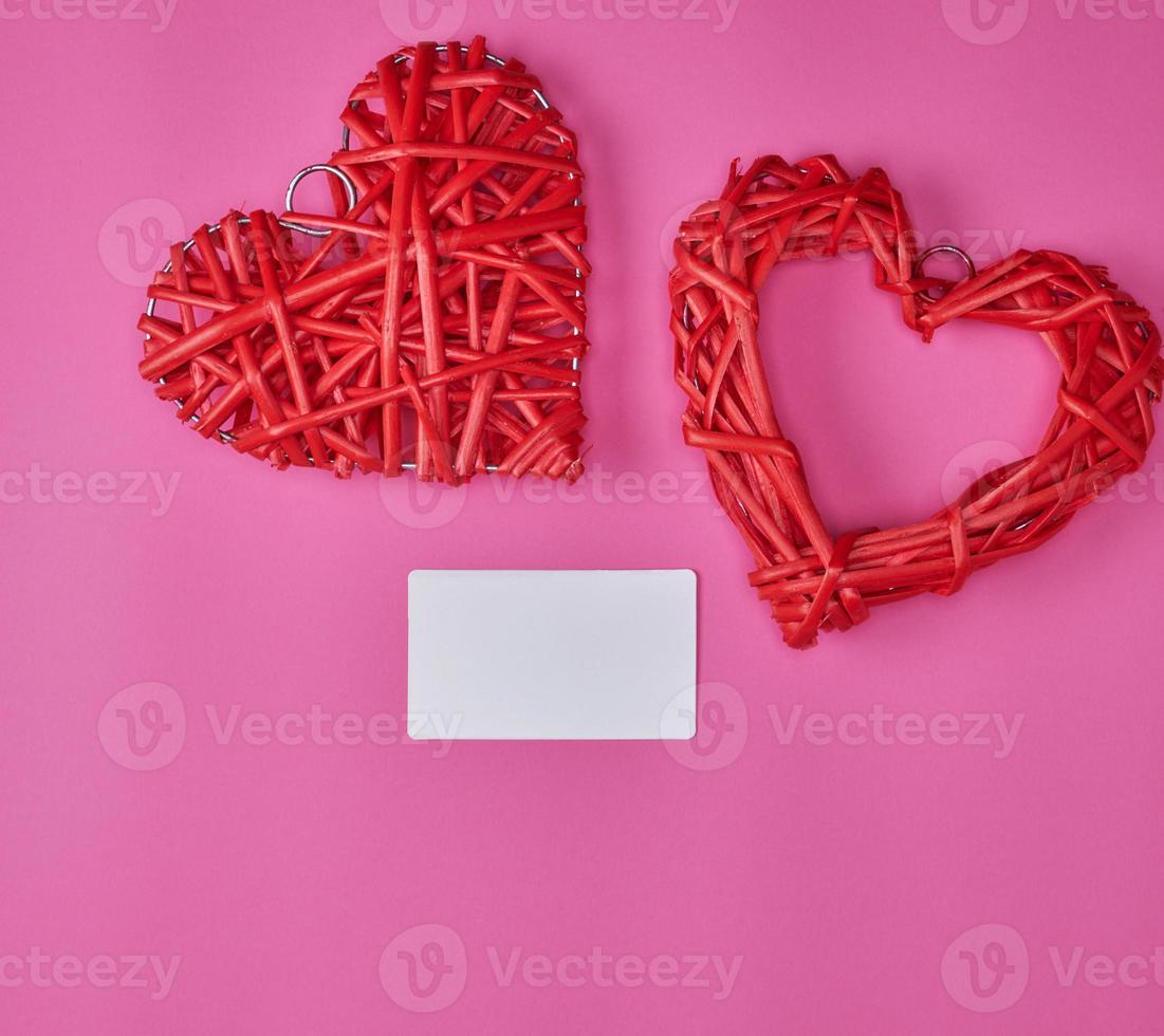 wicker red heart and empty white paper business card photo