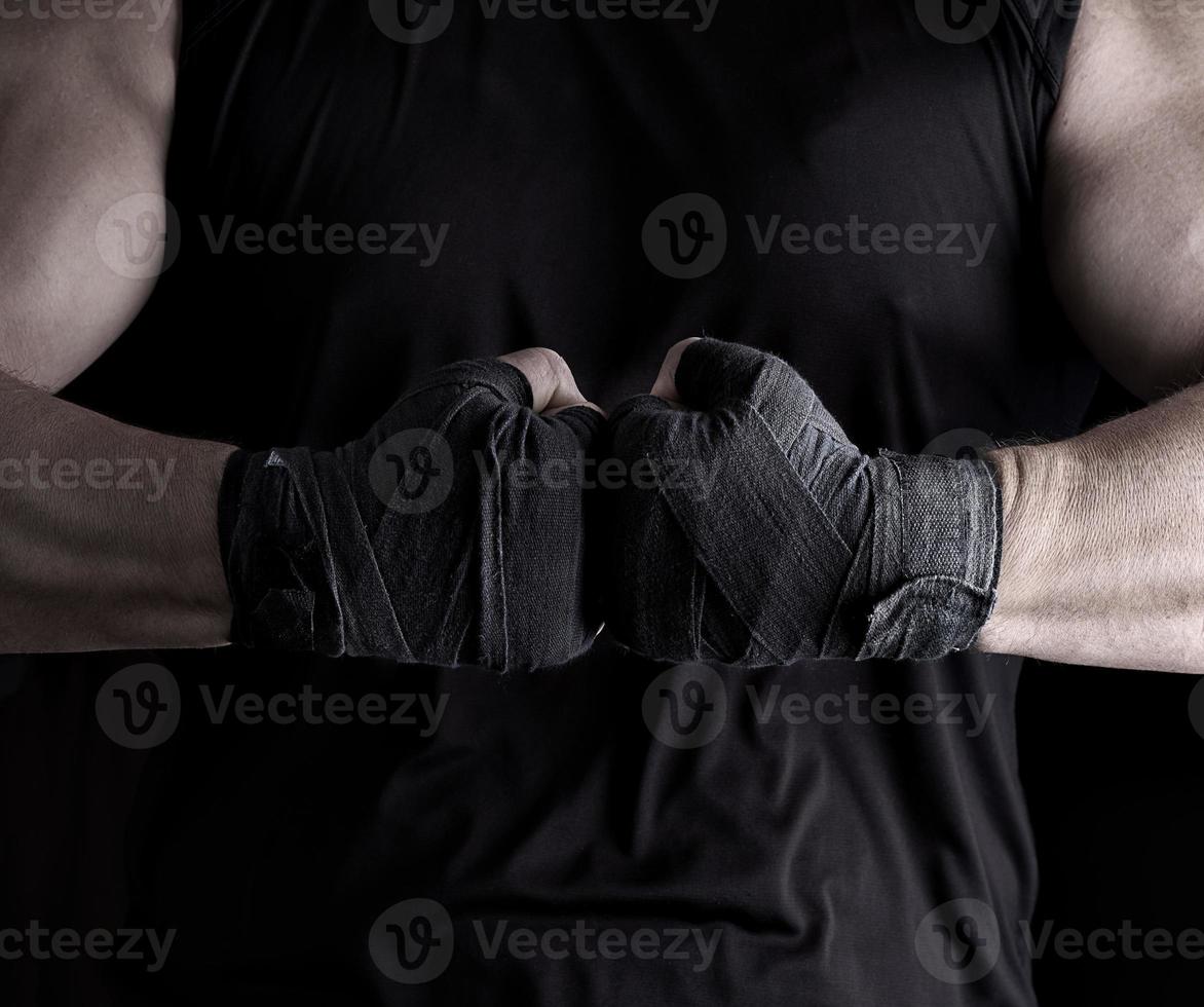 two men's hands wrapped in a black bandage photo