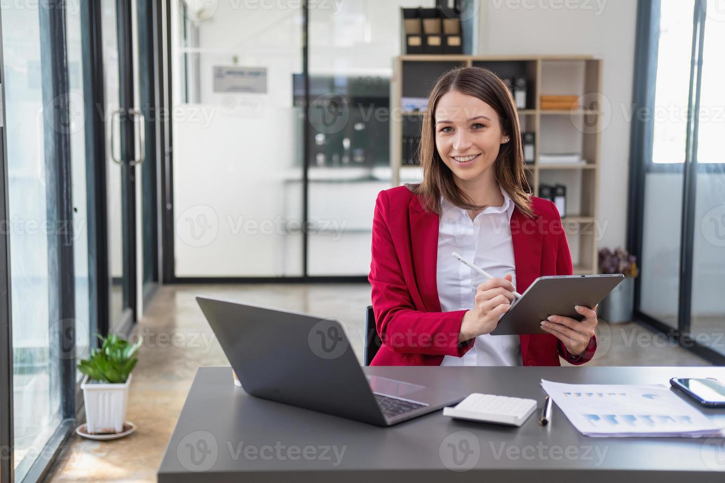 Marketing, Financial, Accounting, Planning, The president of the company sits in his office with a tablet, calculator, pen and graph paper attached to a blackboard for his work. photo