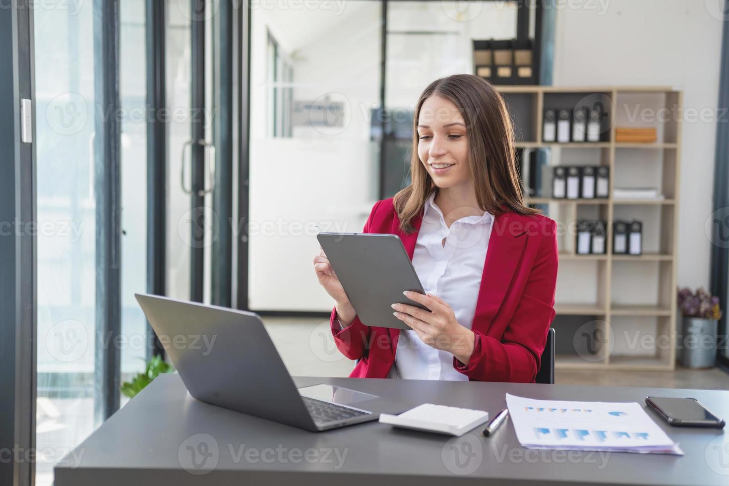 Marketing, Financial, Accounting, Planning, The president of the company sits in his office with a tablet, calculator, pen and graph paper attached to a blackboard for his work. photo