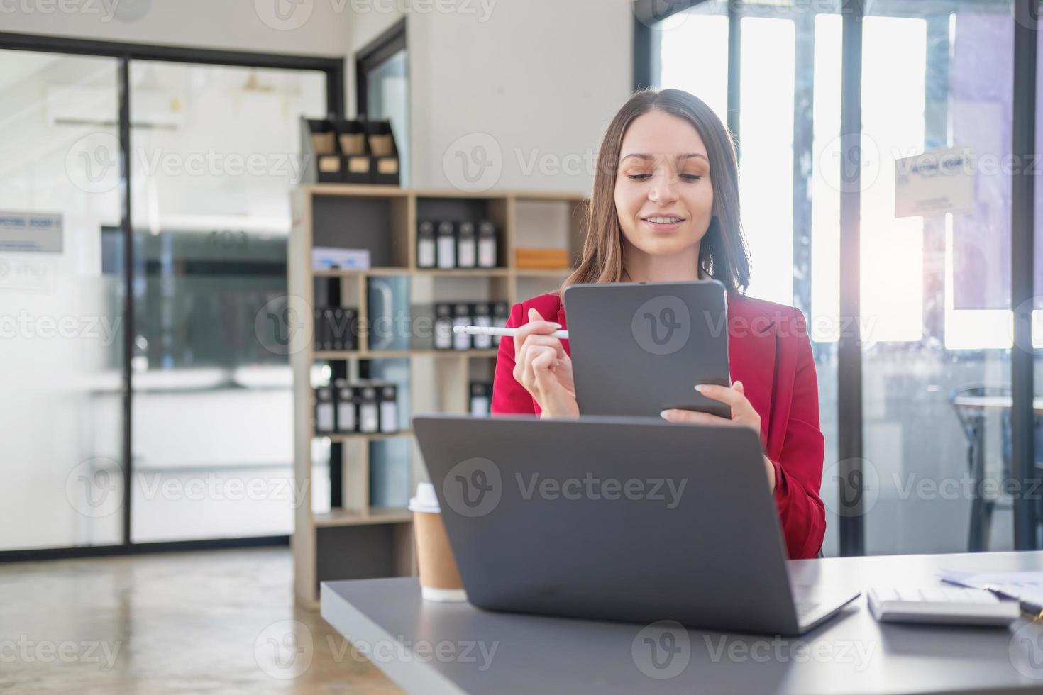 Marketing, Financial, Accounting, Planning, The president of the company sits in his office with a tablet, calculator, pen and graph paper attached to a blackboard for his work. photo