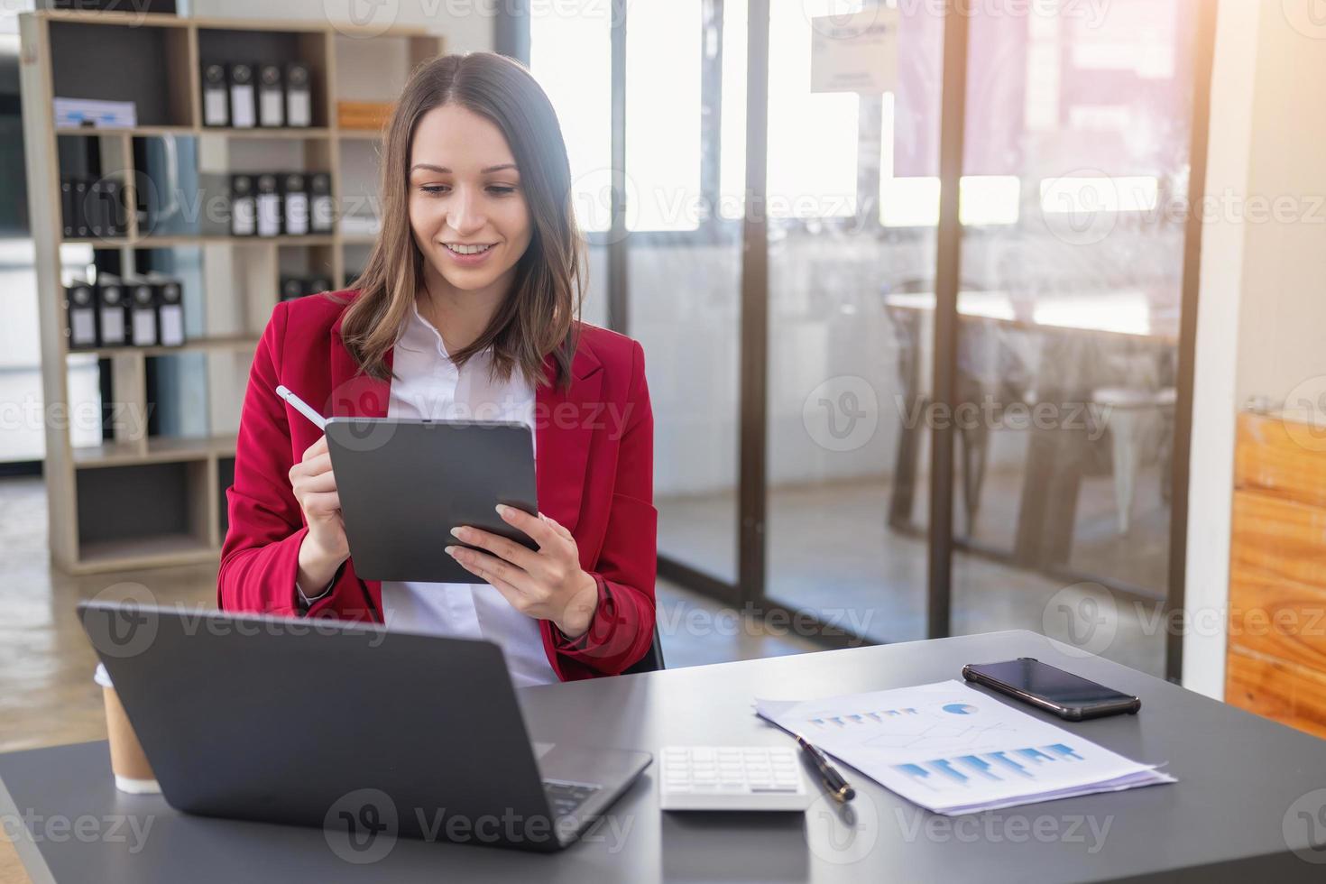 Marketing, Financial, Accounting, Planning, The president of the company sits in his office with a tablet, calculator, pen and graph paper attached to a blackboard for his work. photo
