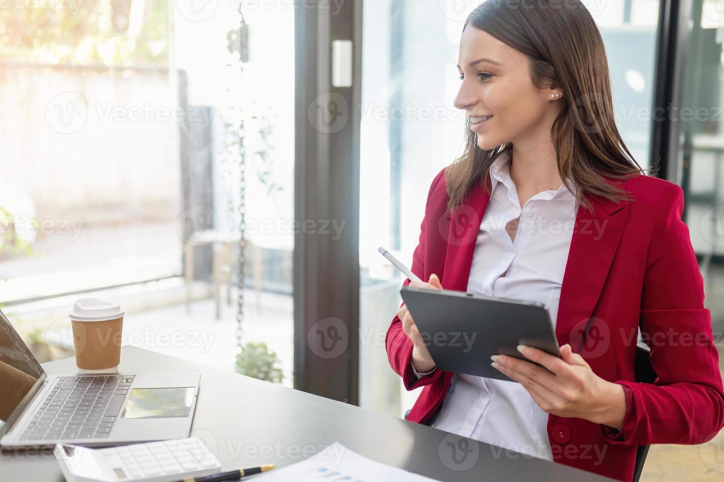 Marketing, Financial, Accounting, Planning, The president of the company sits in his office with a tablet, calculator, pen and graph paper attached to a blackboard for his work. photo