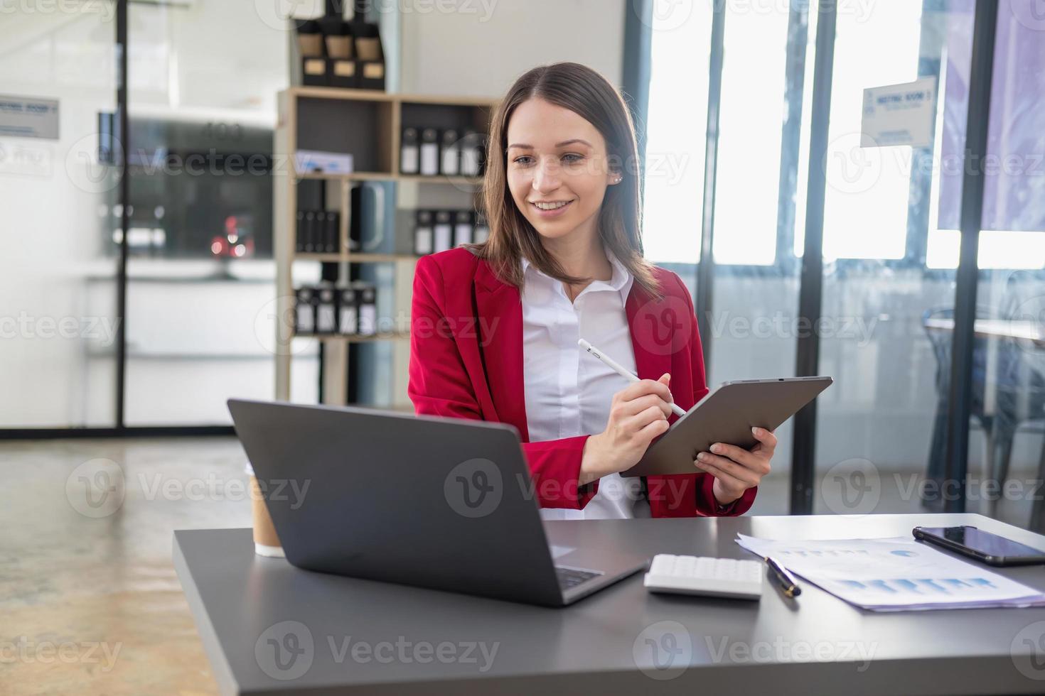 Marketing, Financial, Accounting, Planning, The president of the company sits in his office with a tablet, calculator, pen and graph paper attached to a blackboard for his work. photo