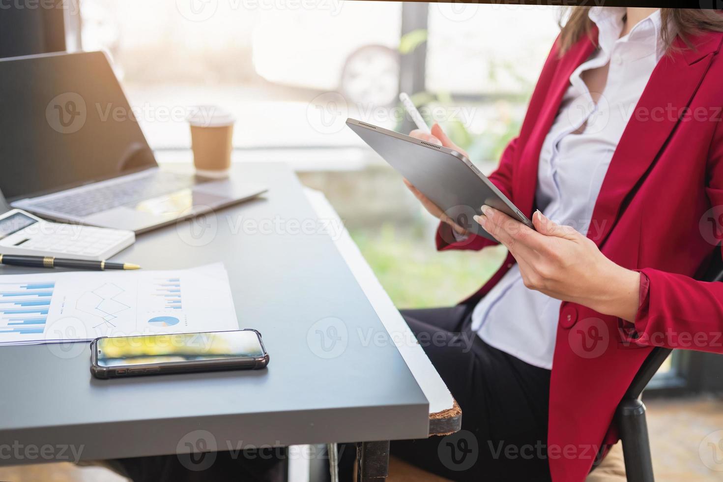 Marketing, Financial, Accounting, Planning, The president of the company sits in his office with a tablet, calculator, pen and graph paper attached to a blackboard for his work. photo