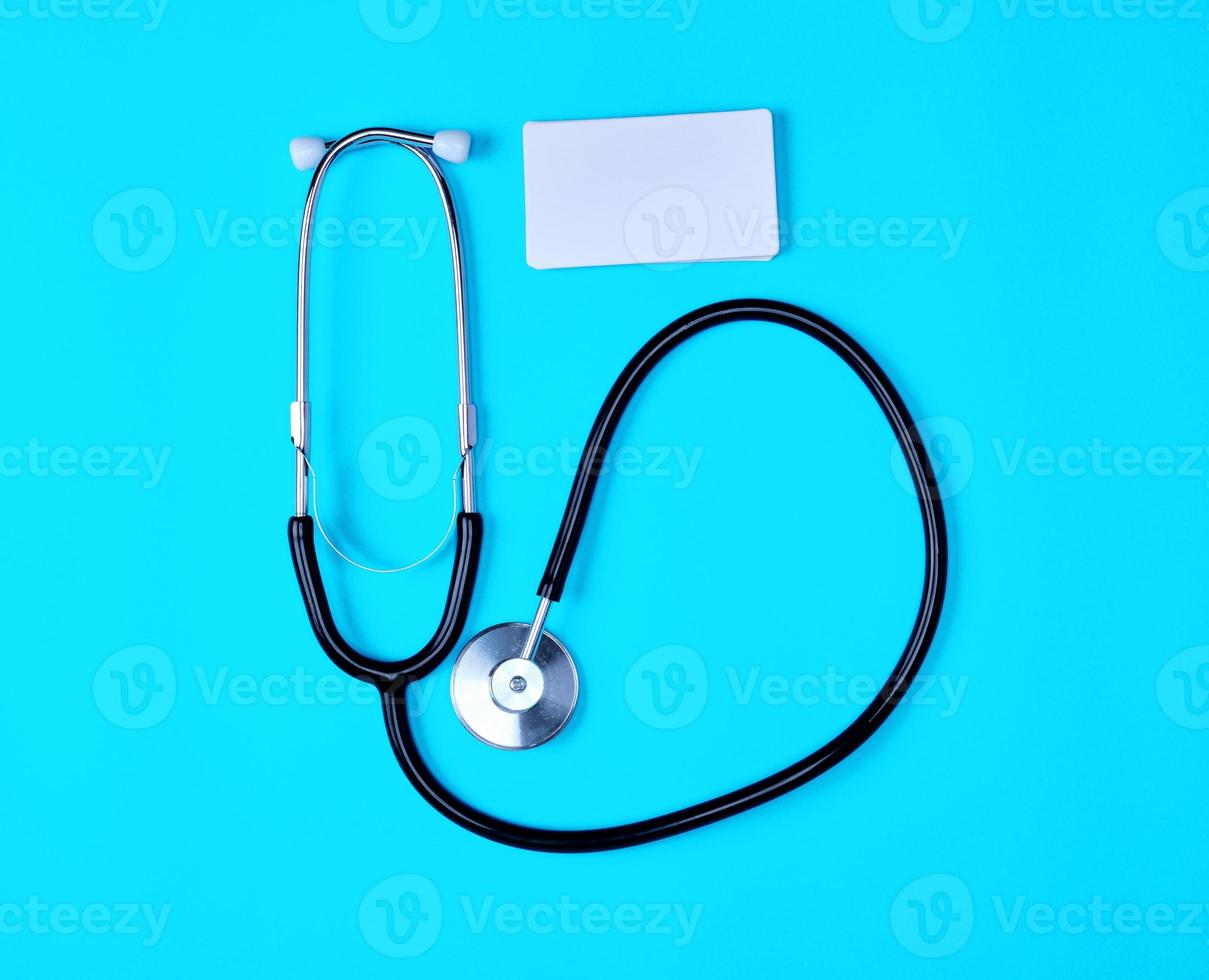 medical stethoscope and empty paper business cards photo