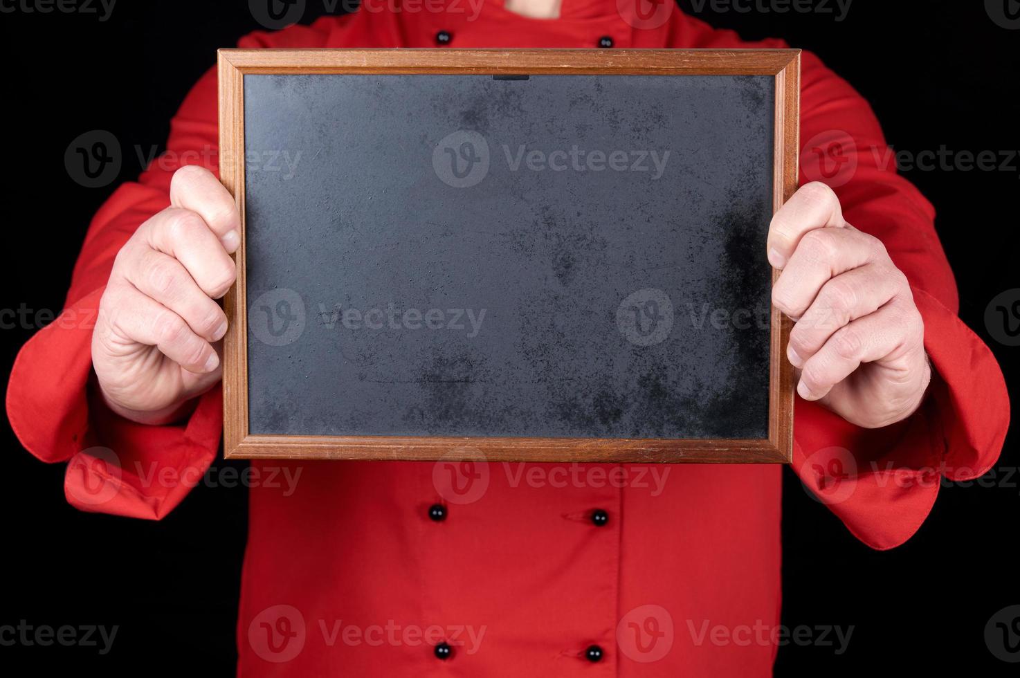 chef in red uniform holding an empty wooden frame photo