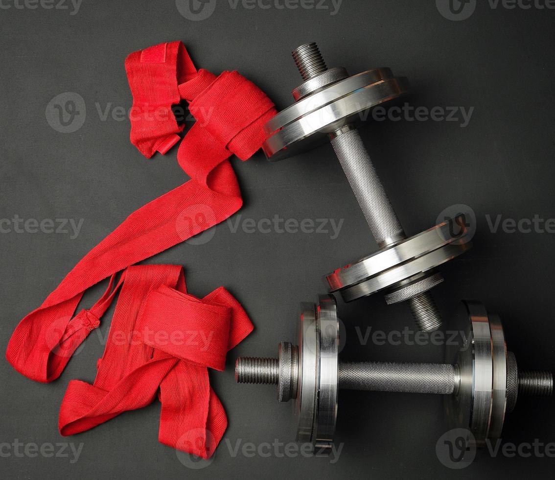 pair of shiny steel typesetting dumbbells for bodybuilding photo