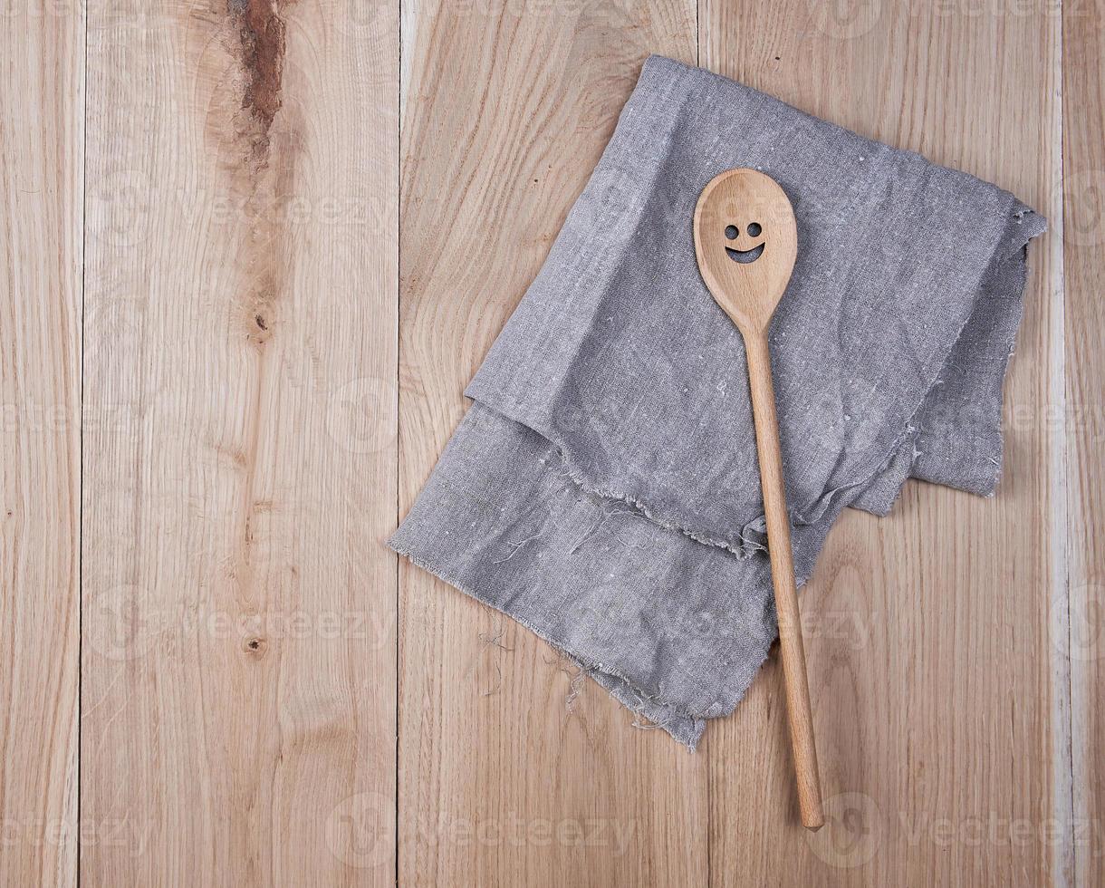 folded gray towel and spoon photo