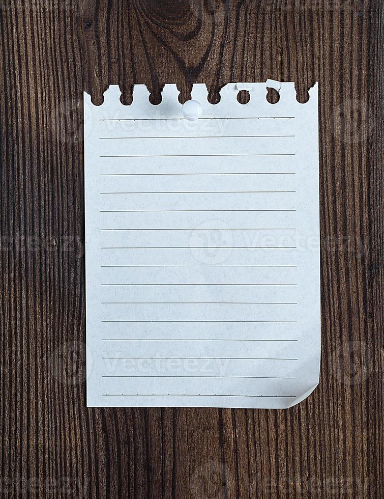 empty notepad paper attached with a button photo