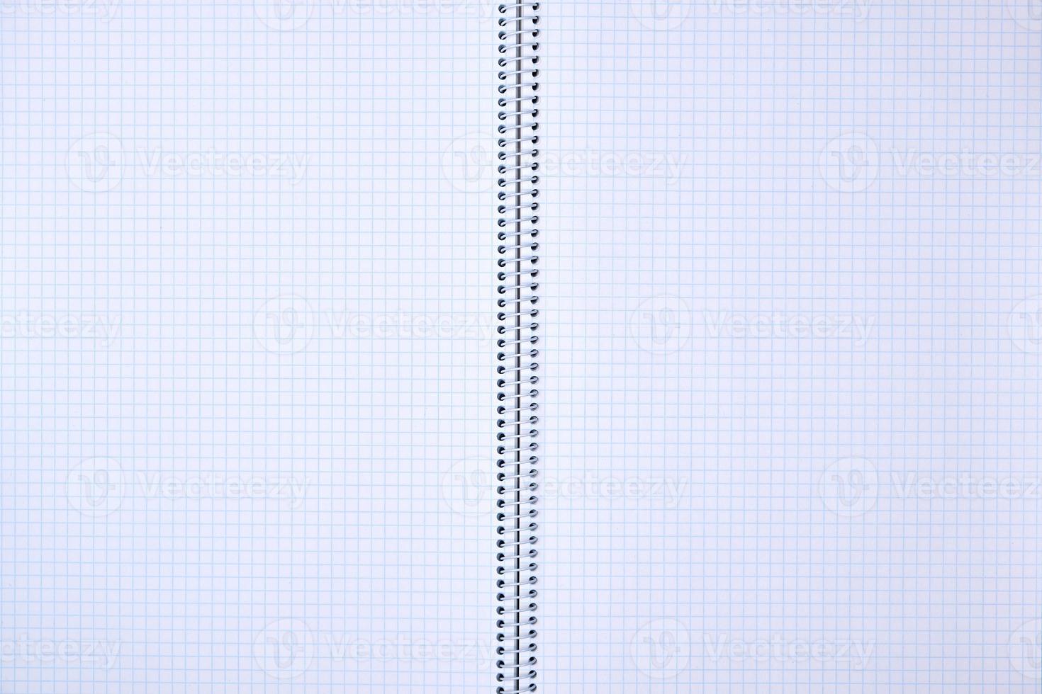 open notebook in a cell with white sheets photo