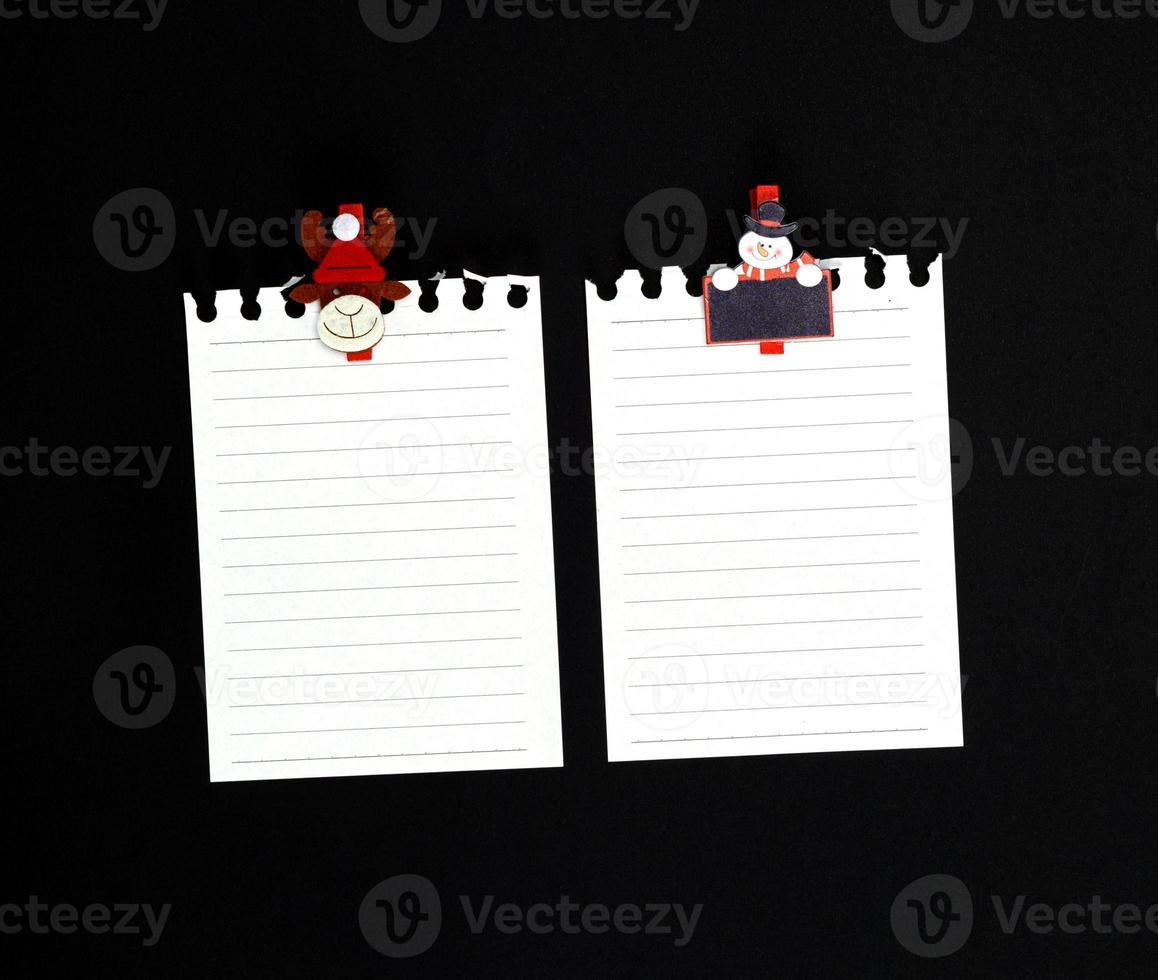 two white blank sheet in a line torn out of notepad photo