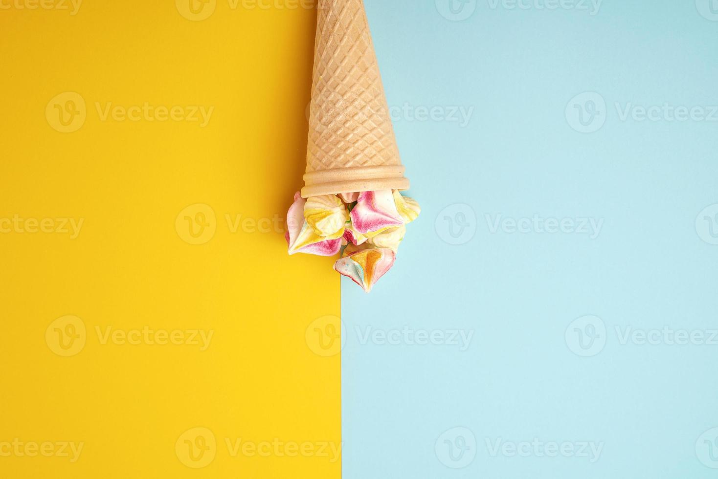 multi-colored baked meringues in a waffle cup photo